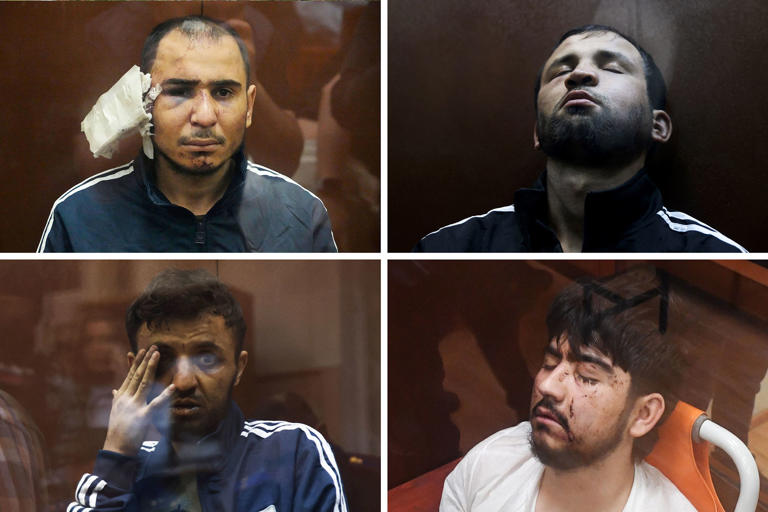 Four men suspected of carrying out a terror attach at Crocus City Hall, await charges in a Moscow court on March 22, 2024. (AP; AFP via Getty Images)