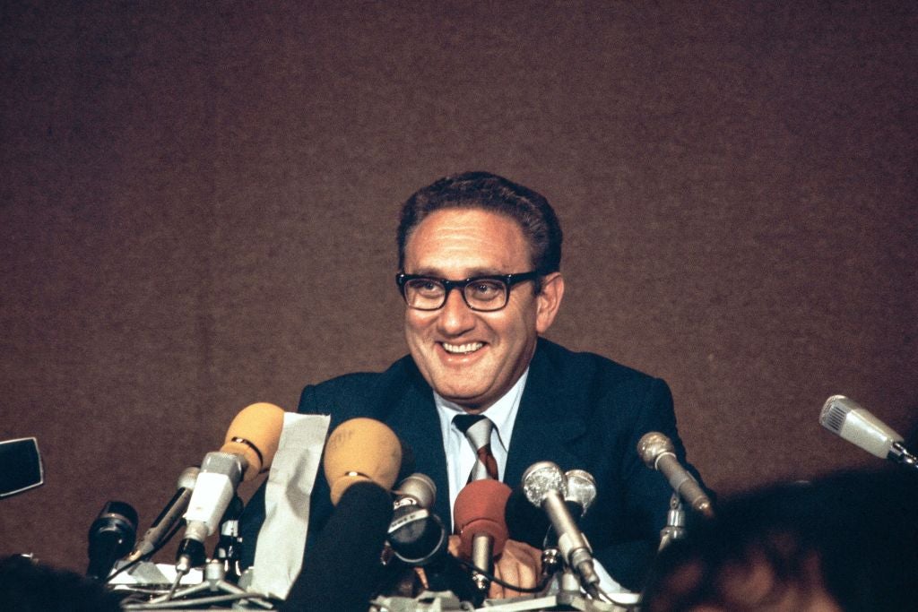 <p>US President Nixon’s special advisor Henry Kissinger laughs during a press conference, after the implementation of the Paris Peace Accords, with North Vietnam in Paris on June 13, 1973</p>