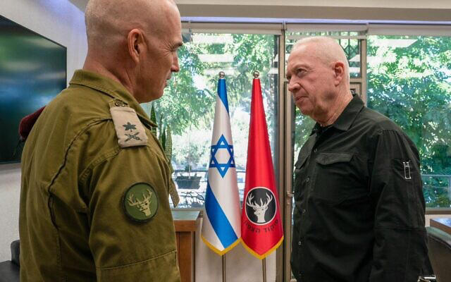 Defense Minister Yoav Gallant (left) speaks with the head of the IDF Northern Command, Maj. Gen. Ori Gordin, at an intelligence base in northern Israel, August 13, 2024. (Ariel Hermoni/Defense Ministry)