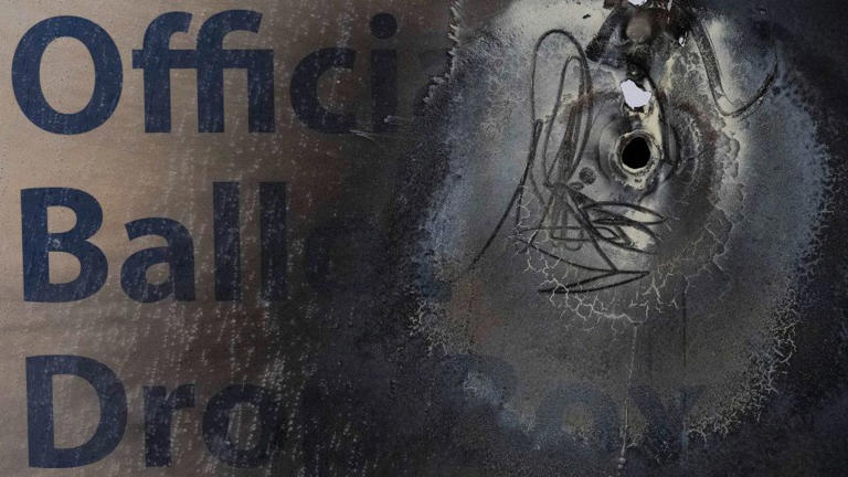 A damaged ballot drop box is displayed during a news conference at the Multnomah County Elections Division office on Monday in Portland, Oregon. - Jenny Kane/AP